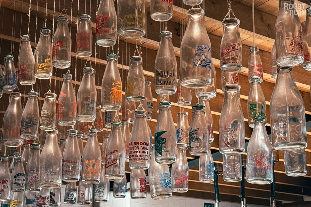 Dangling milk bottles The Creamery
